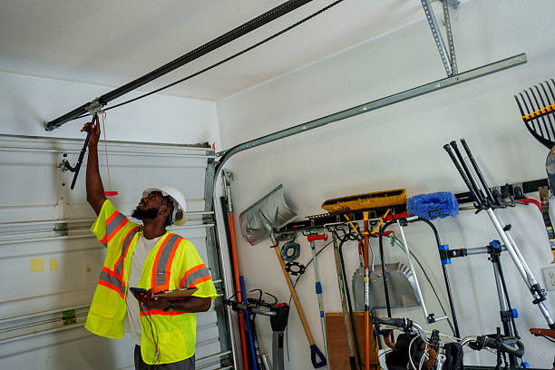 Professional Garage Door Panel Replacement technician working in Roland, OK